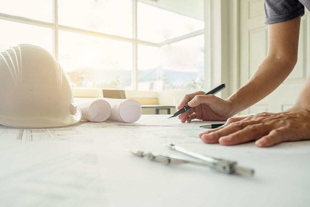 hands engineer working blueprint construction concept engineering tools vintage tone retro filter effect soft focus selective focus_1418 602